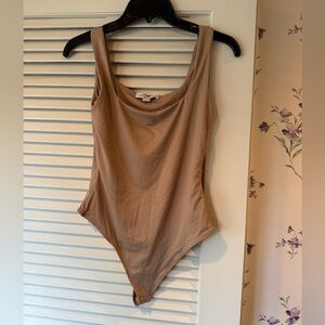 And Now This Tan Thong Bodysuit in Size Medium